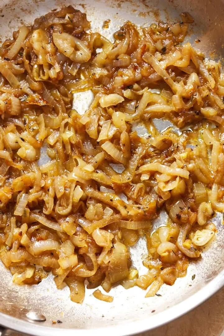 Delicious caramelized onions cooked to perfection, adding a rich flavor to various dishes.