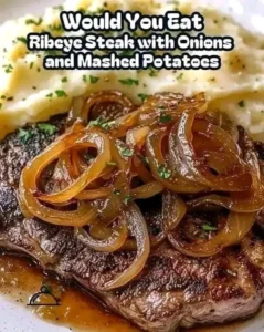 Caramelized ribeye steak served with creamy mashed potatoes on a plate