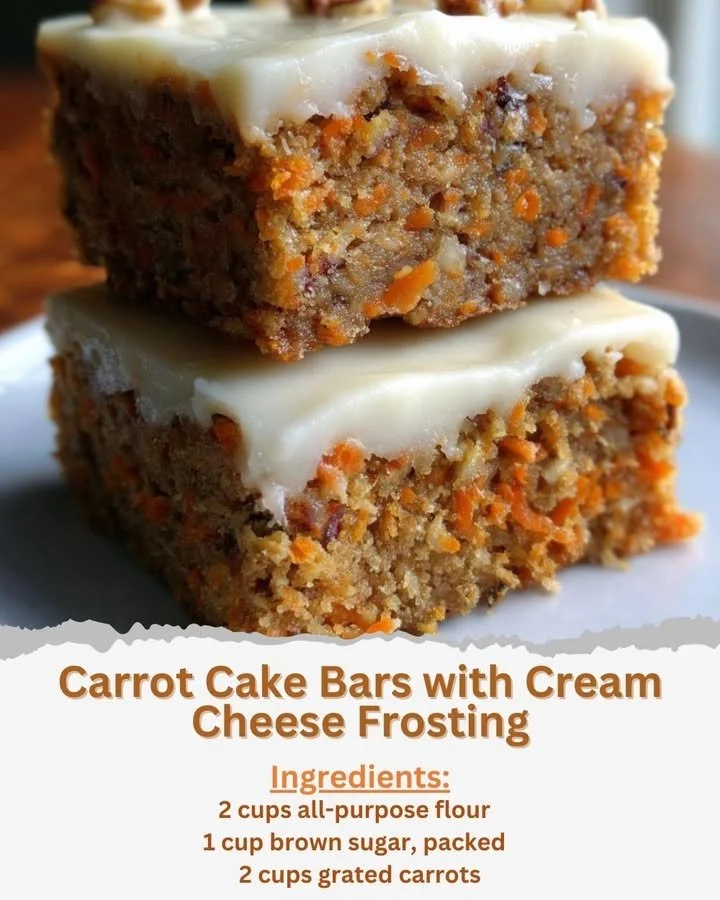 Delicious carrot cake bars with cream cheese frosting on a plate.