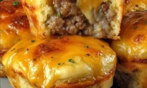Savory Cheddar Sausage Muffins fresh out of the oven, perfect for any meal.