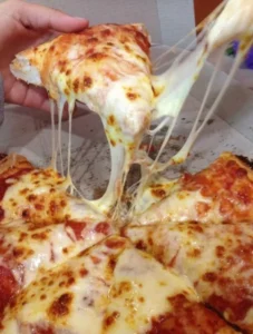 Delicious cheese pizza with melted cheese and fresh ingredients