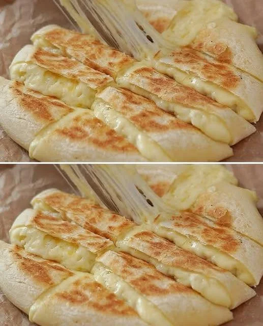 Homemade cheese potato bread cooked in a frying pan, golden and crispy.