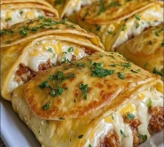 Delicious cheeseburger puffs topped with sesame seeds on a platter
