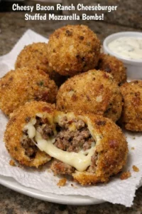 Cheesy bacon ranch cheeseburger stuffed mozzarella bombs on a plate