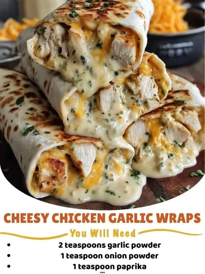 Cheesy chicken garlic wraps served on a plate with fresh vegetables