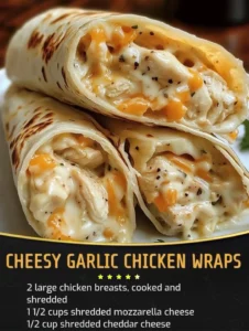 Delicious cheesy garlic chicken wraps on a plate, garnished with herbs.