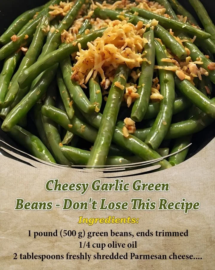 Plate of Cheesy Garlic Green Beans garnished with cheese and herbs