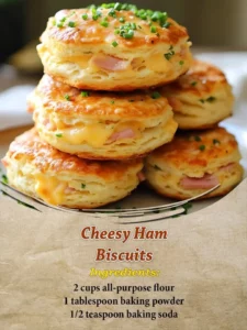 Cheesy ham biscuits served on a plate with herbs garnishing