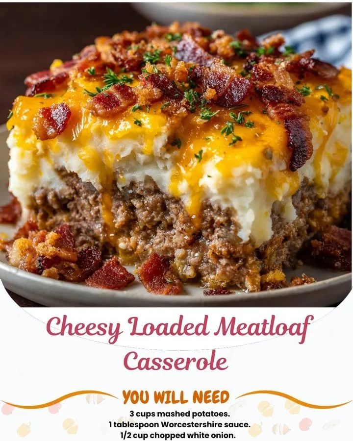 Cheesy loaded meatloaf casserole topped with melted cheese and fresh herbs
