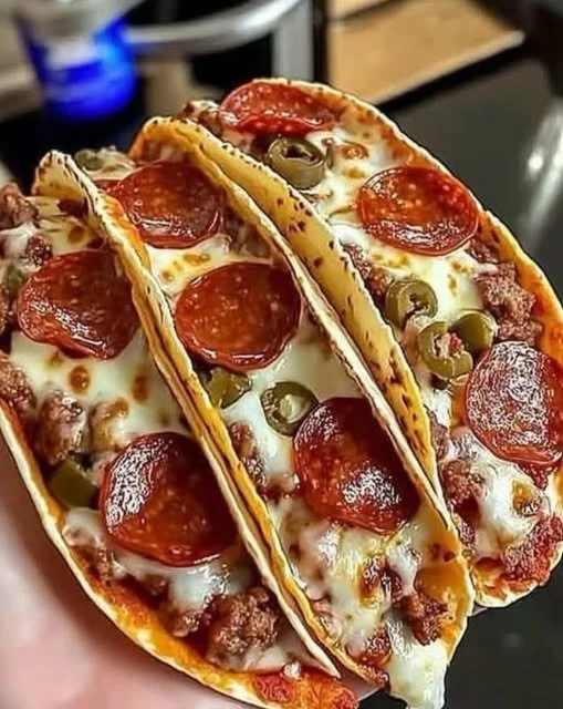 Cheesy pepperoni pizza tacos with seasoned beef and mozzarella cheese