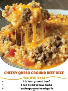 Cheesy queso ground beef rice dish garnished with cilantro