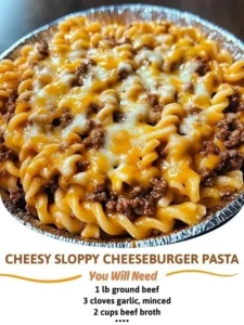Cheesy Sloppy Cheeseburger Pasta topped with melted cheese and fresh herbs
