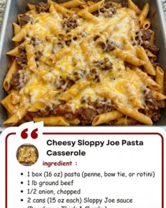 Cheesy Sloppy Joe Pasta Casserole topped with melted cheese and fresh herbs