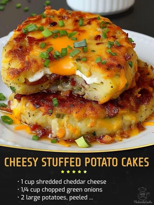 Cheesy stuffed potato cakes served on a plate, garnished with herbs.