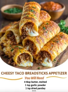Cheesy taco breadsticks appetizer served with dipping sauce