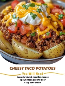 Cheesy Taco Potatoes served in a bowl, topped with cheese and fresh toppings