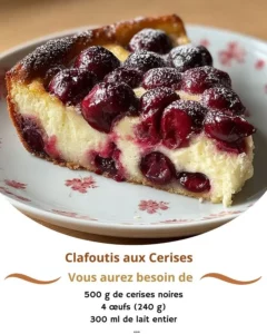 Delicious Cherry Clafoutis served with fresh cherries and powdered sugar