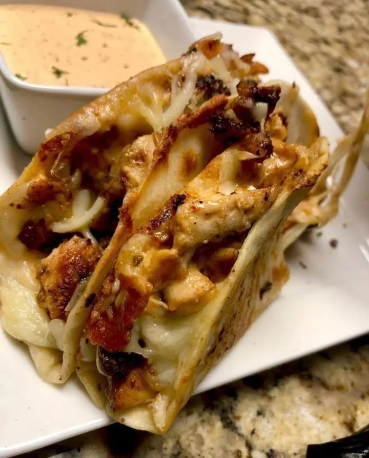Delicious Chicken Bacon Ranch Tacos served on a plate with fresh toppings