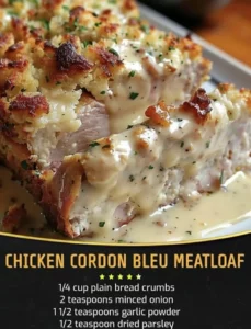 Delicious Chicken Cordon Bleu Meatloaf sliced on a plate with herbs.