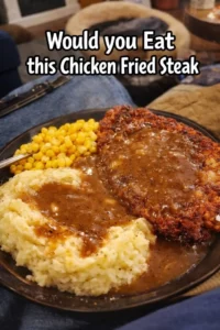 Delicious Chicken Fried Steak topped with creamy gravy on a plate