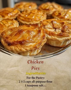 Delicious homemade chicken pies served on a rustic wooden table