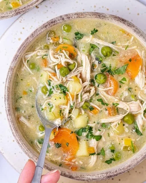 Bowl of creamy Chicken Pot Pie Soup with vegetables and chicken pieces