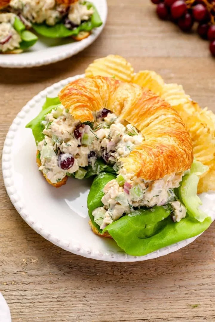 Healthy chicken salad served in a bowl with fresh vegetables