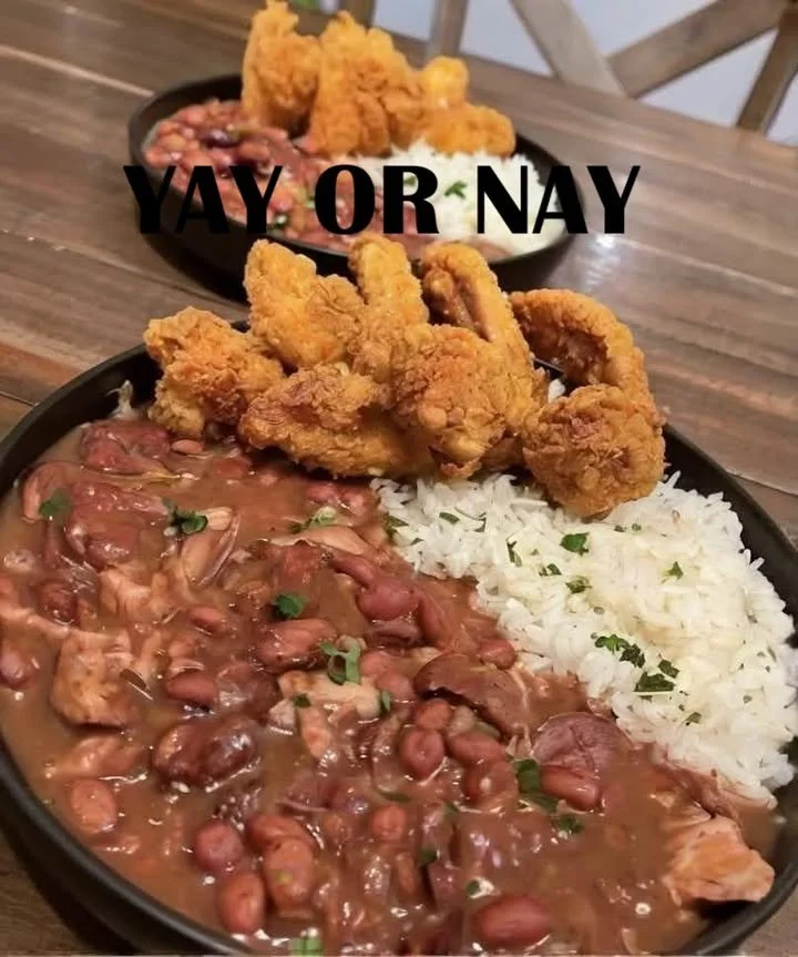 Delicious chicken wings served with red beans and rice on a plate