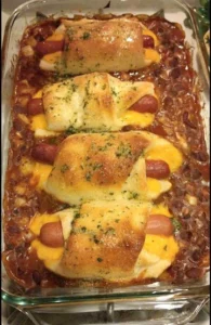 Savory Chili Cheese Dog Bake topped with melted cheese and hearty chili.