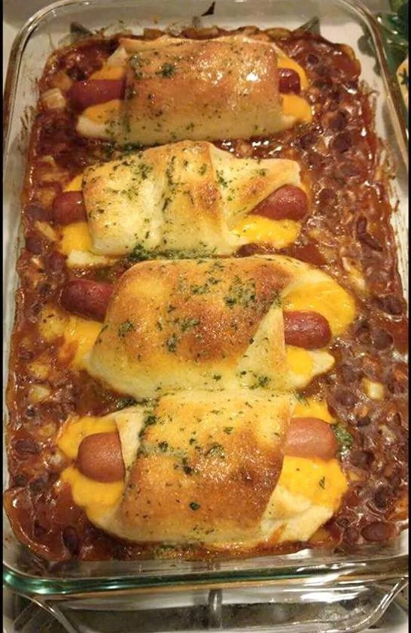 Savory Chili Cheese Dog Bake topped with melted cheese and hearty chili.