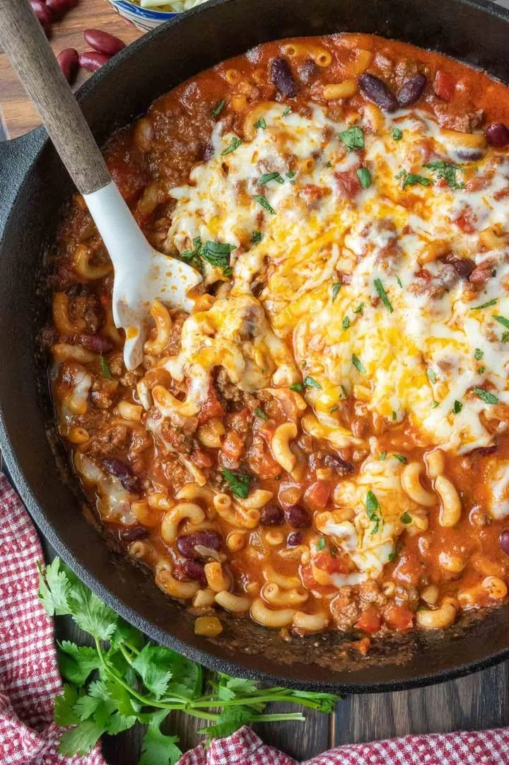 Delicious Chili Macaroni Casserole topped with cheese and herbs.