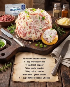 Chipped beef cheese ball served with crackers on a wooden platter
