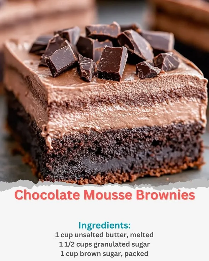 Delicious chocolate mousse brownies topped with mousse and chocolate shavings