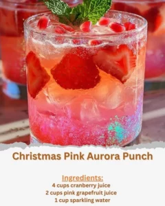 Christmas Pink Aurora Punch in a festive glass with holiday decorations