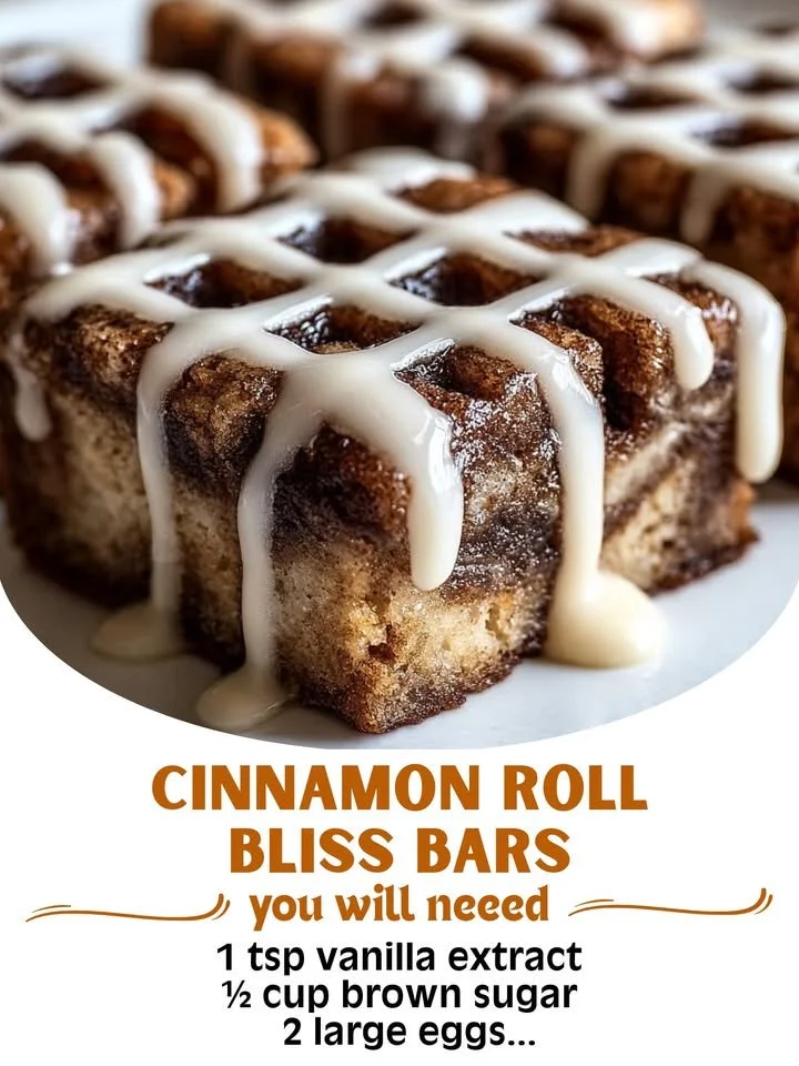Cinnamon Roll Bliss Bars topped with cream cheese frosting and sprinkled with cinnamon