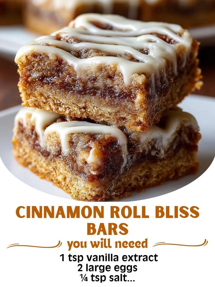 Deliciously drizzled Cinnamon Roll Bliss Bars on a plate.