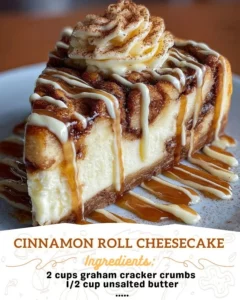 Delicious cinnamon roll cheesecake topped with swirls of icing and cinnamon.