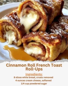 Cinnamon roll French toast roll-ups served with syrup and berries.