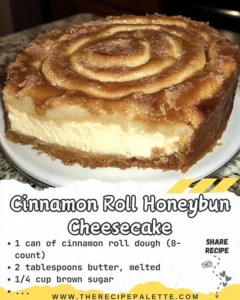 Delicious Cinnamon Roll Honeybun Cheesecake topped with a cinnamon swirl