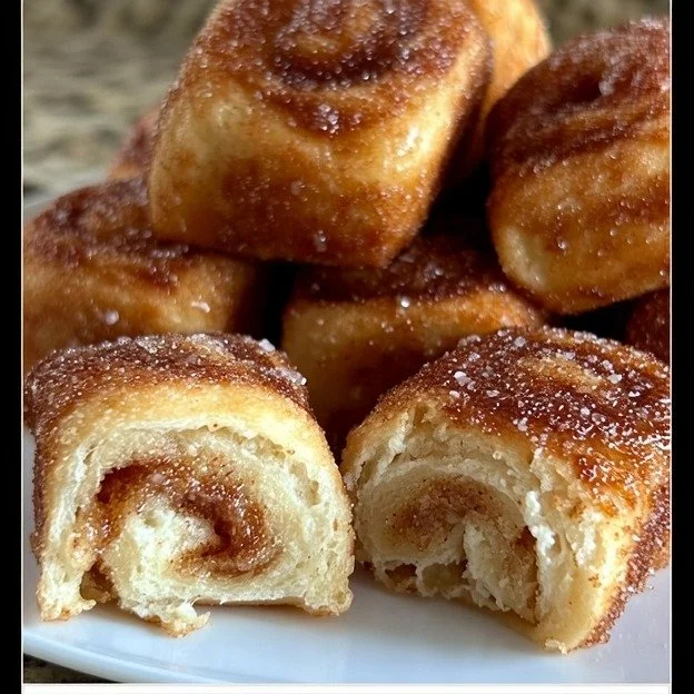 Delicious homemade Cinnamon Sugar Roll Bites served on a white plate.