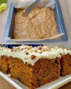 Slice of classic carrot cake with creamy frosting on a plate