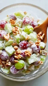 Classic Waldorf Salad with apples, walnuts, and grapes served in a bowl.