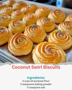 Homemade Coconut Swirl Biscuits with a golden crust and coconut topping