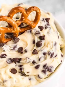 Delicious cookie dough dip served in a bowl with dipping snacks