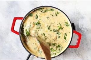 Bowl of creamy chicken gnocchi soup inspired by Olive Garden recipe.