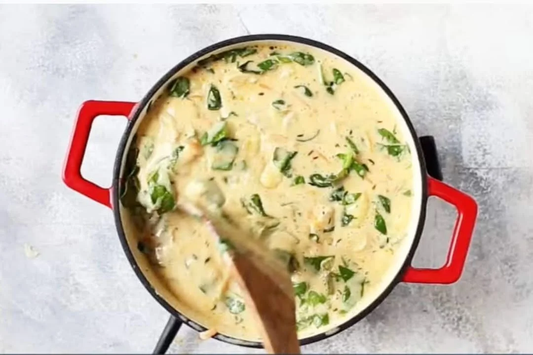 Bowl of creamy chicken gnocchi soup inspired by Olive Garden recipe.