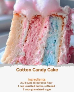 Colorful Cotton Candy Cake topped with fluffy cotton candy for a festive dessert.