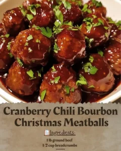 Cranberry Chili Bourbon Christmas Meatballs served with festive garnish