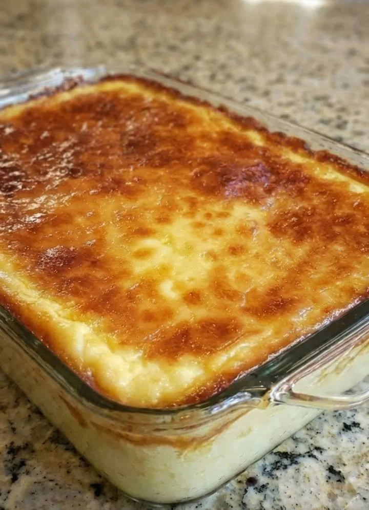 Cream cheese dip served in a bowl with fresh vegetables and crackers