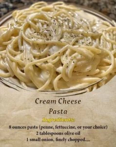 Delicious Cream Cheese Pasta garnished with herbs in a white bowl